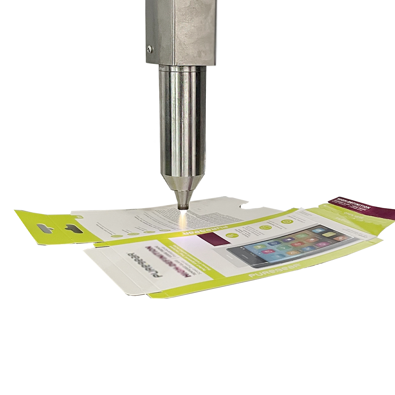 Atmospheric plasma nozzle treating a folding carton glue flap before adhesive application